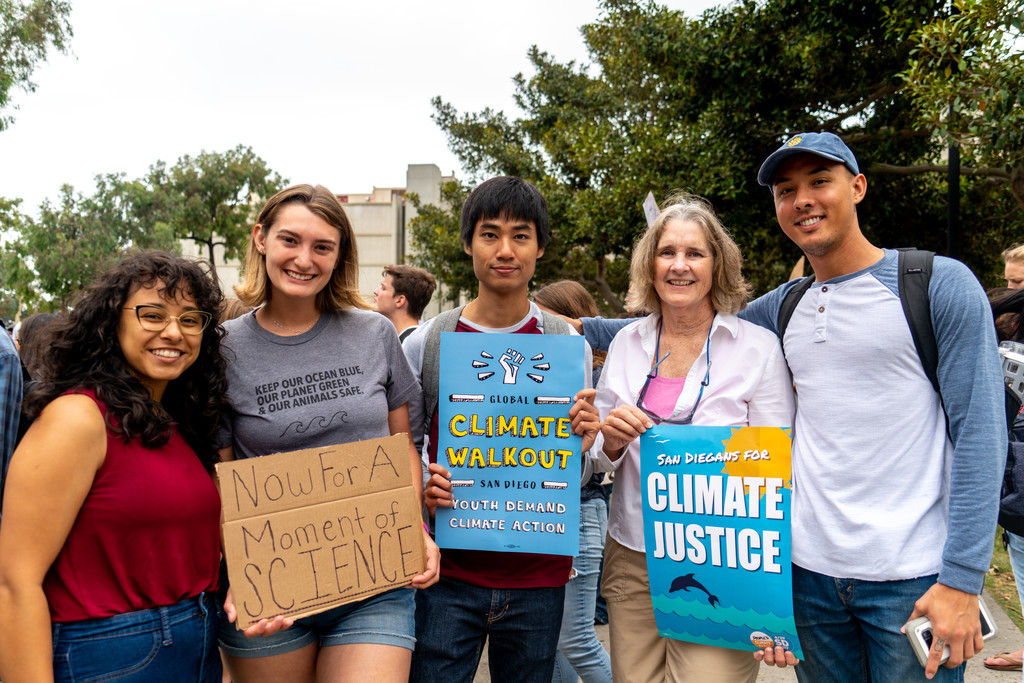 Students holding climate justice signs.